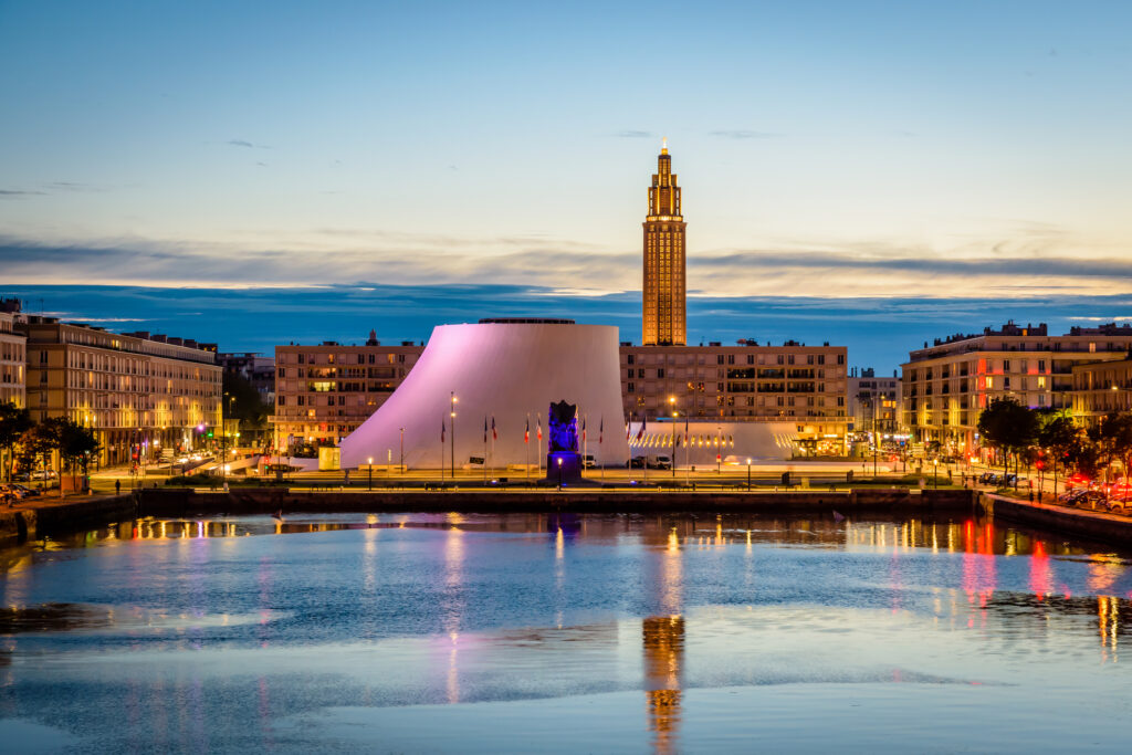 The Volcan theater and St. Joseph`s Church at nightfall in Le Havre, France