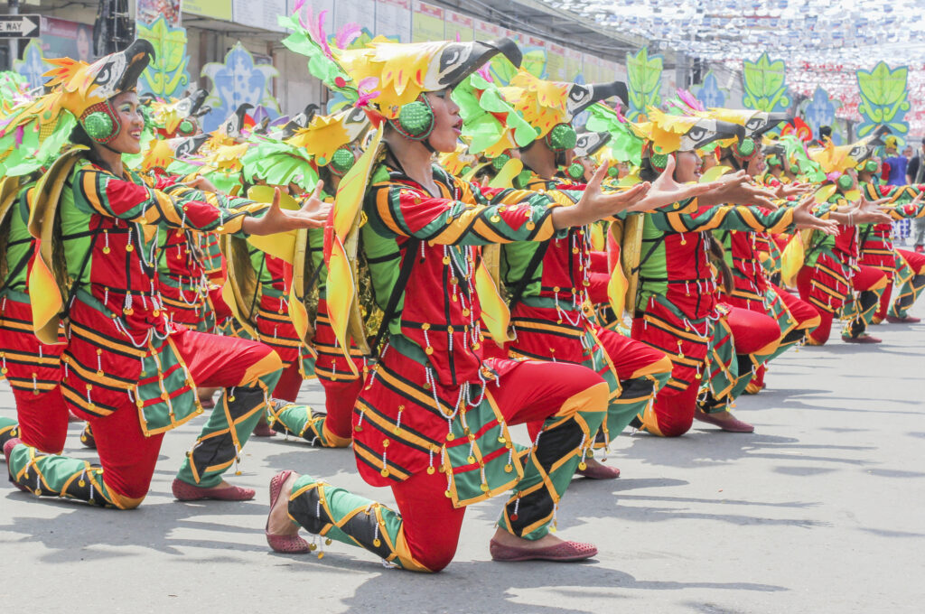 Participant of Kadayawan festival leads at Bonifacio Street in Davao City, Philippines