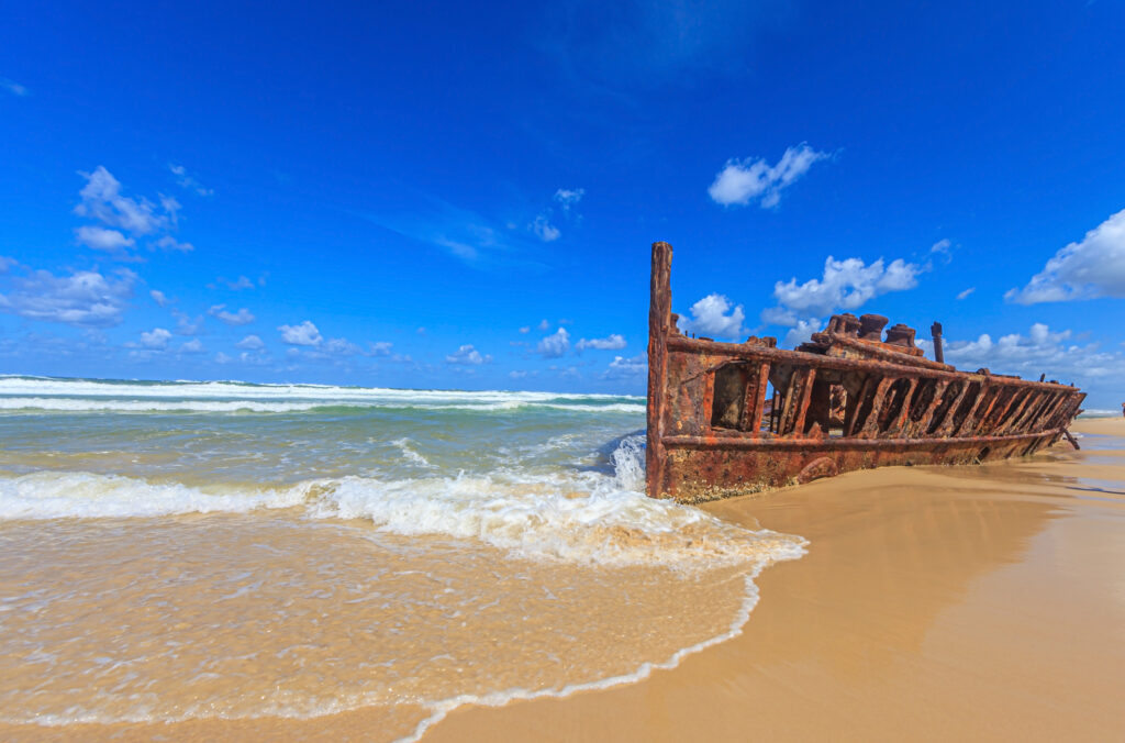 Picture of a rusted shipwreck at Seventy Five Mile Beach on Frazer Island in Australia