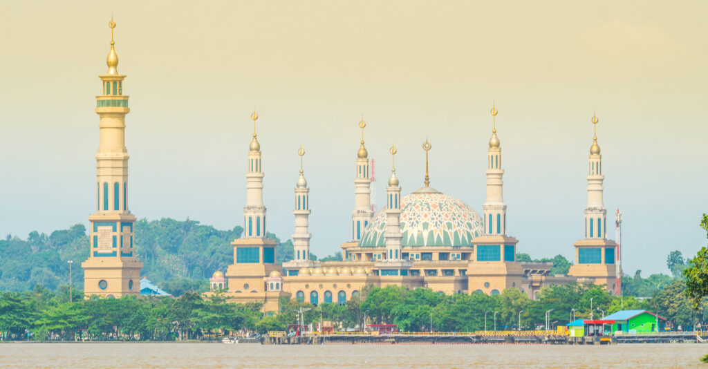 Beautiful view of the great mosque from the river at dusk in Samarinda, Indonesia