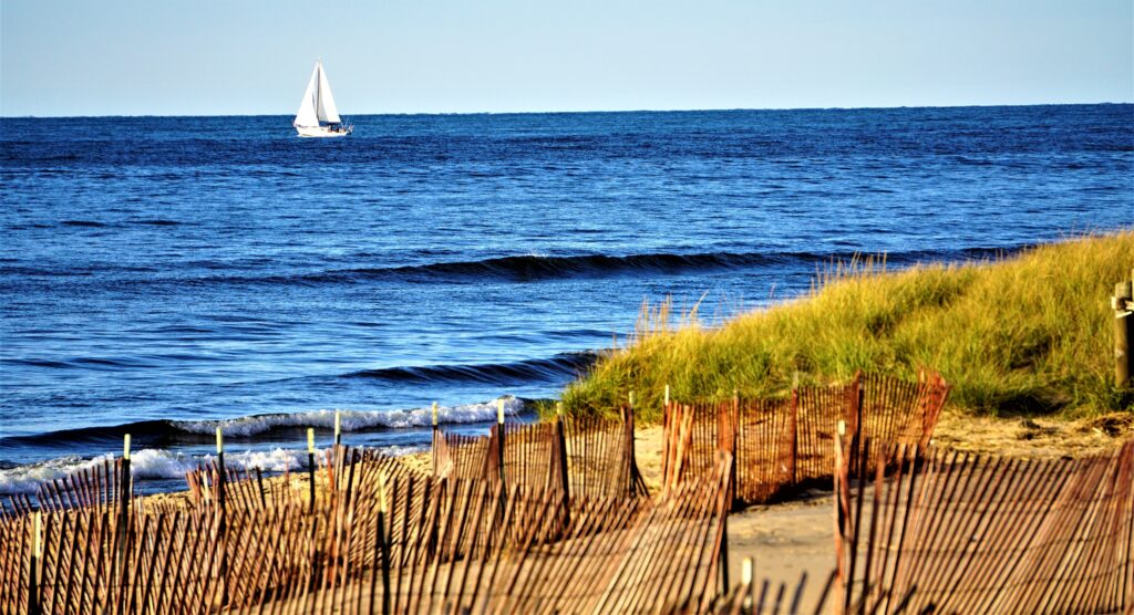 Winterized Oval Beach at Saugatuck MI with view of small sailboat