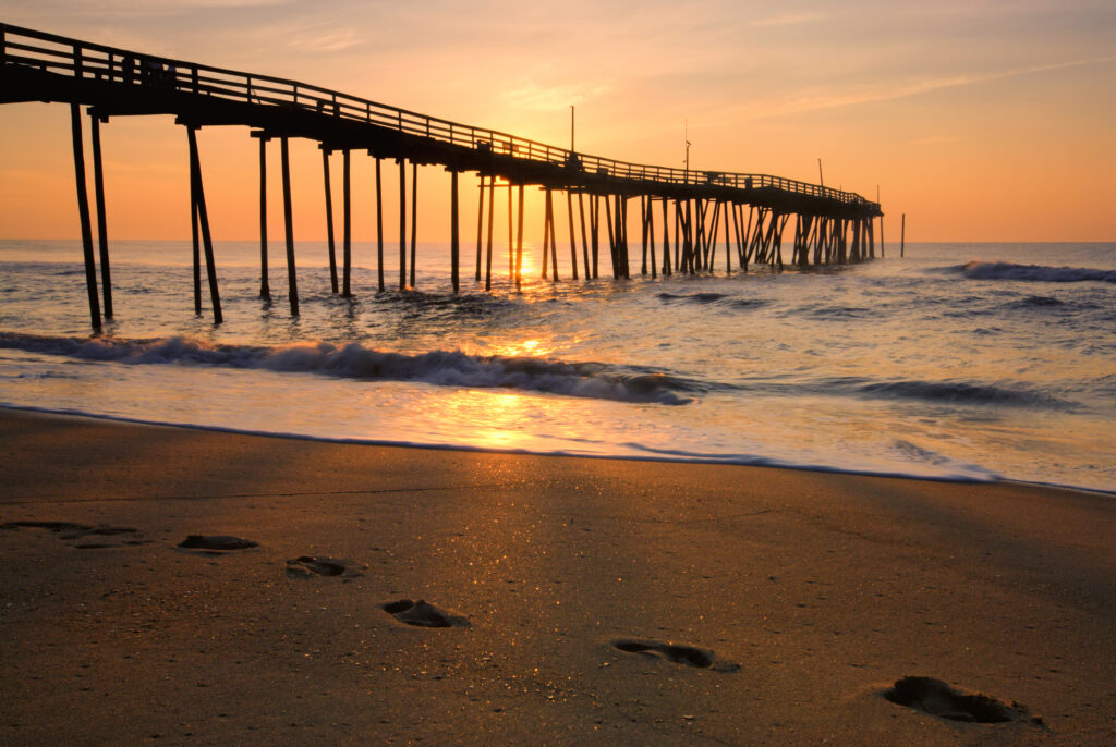 Sunrise and footprints on the Outer Banks, North Carolina