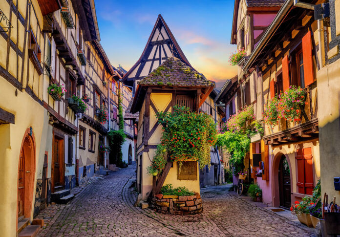 Traditional colorful halt-timbered houses in Eguisheim Old Town on Alsace Wine Route, France
